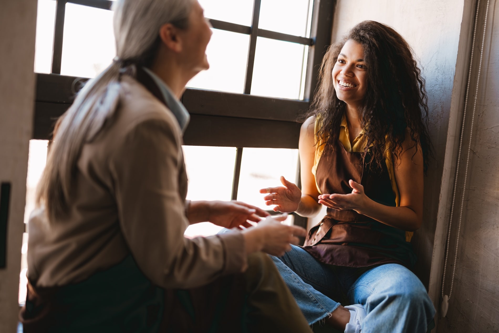 Two women engaged in supportive mentoring or life coaching session